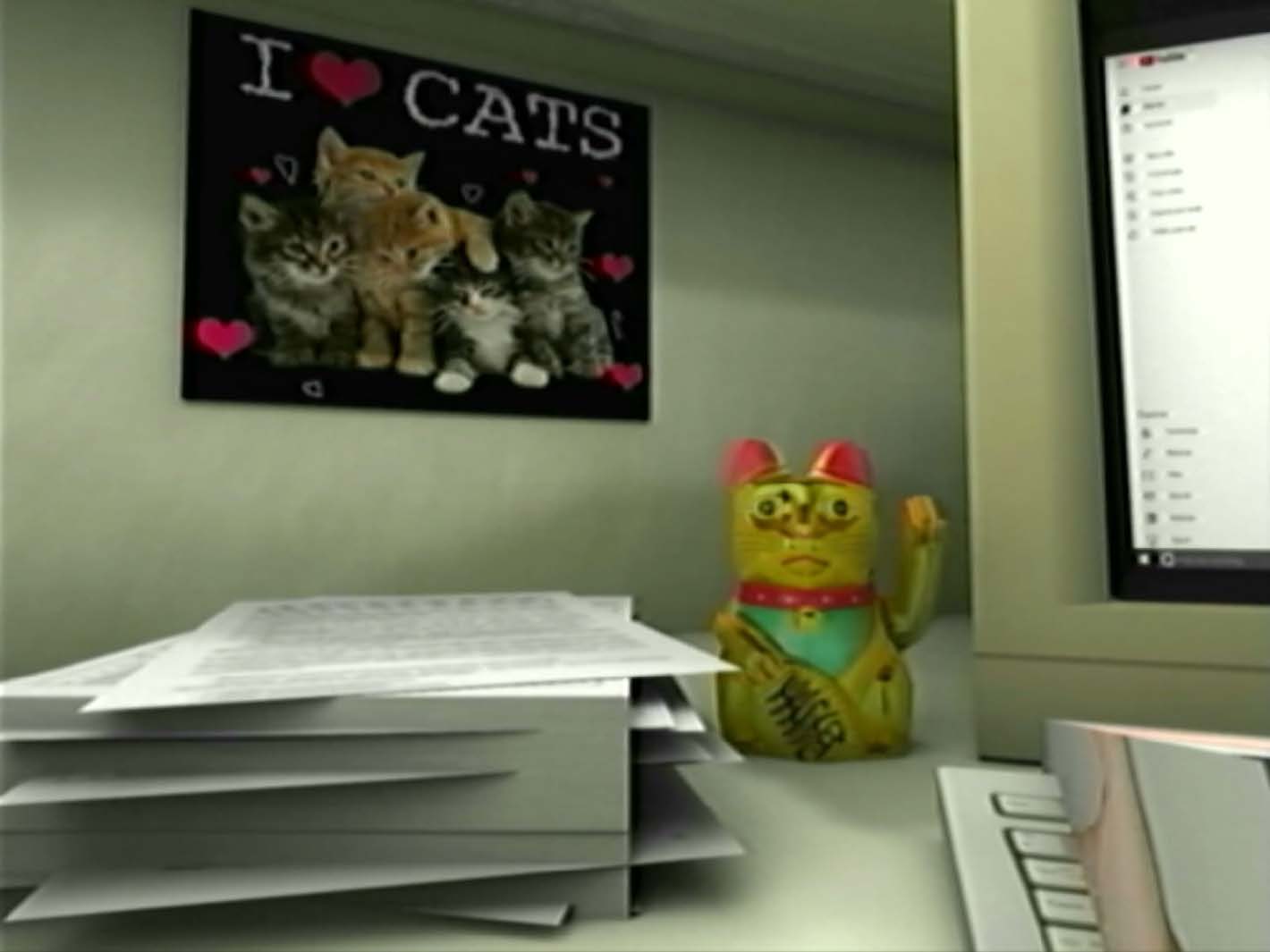 Kdo jsem film still with cat poster and lucky cat.