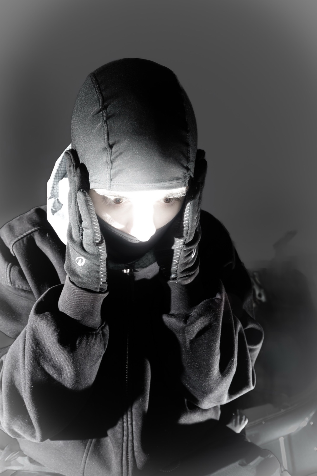 sxilence press portrait with bright light across the eyes.